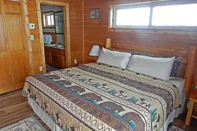 a bedroom with a large bed in a room at Cabin Rental for Large Groups Ideal for Colorado Glamping in Walden