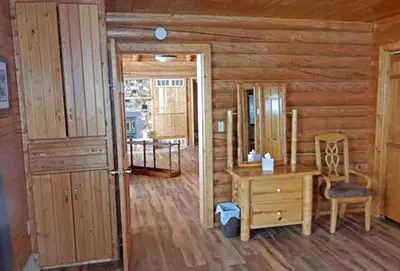 a wooden room with a desk and a chair at Cabin Rental for Large Groups Ideal for Colorado Glamping in Walden