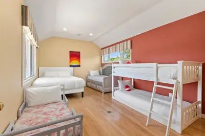 a room with two bunk beds and a couch at Heart of Cherry Creek Group Retreat Hot Tub in Denver