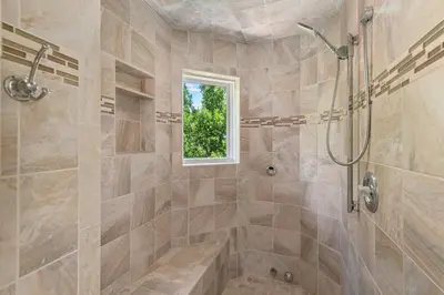a bathroom with a shower and a tub at Heart of Cherry Creek Group Retreat Hot Tub in Denver