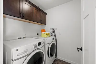 a laundry room with a washer and dryer at 838B Wapiti Dr in Fraser