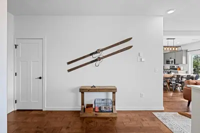 a living room with white walls and a table at 838B Wapiti Dr in Fraser