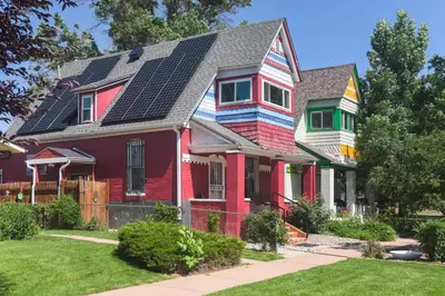 a colorful house with solar panels on its roof at Chic Lower-Level Stay - Prime Walkable Locale in Denver