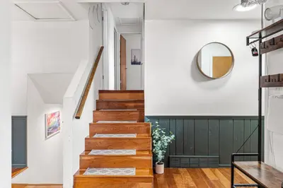 a staircase in a house with a mirror at Spacious and Comfy Close to Everything Backyard in Longmont