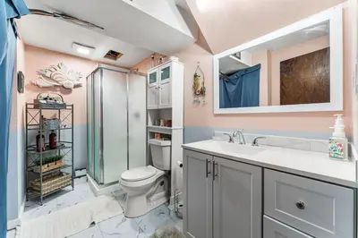 a bathroom with a toilet and a sink and a shower at Spacious and Comfy Close to Everything Backyard in Longmont