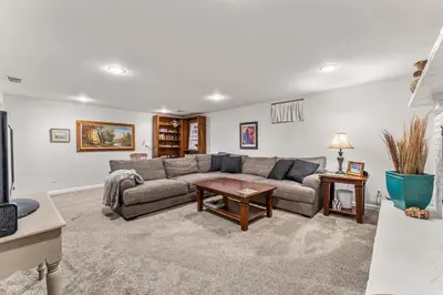 a living room with a couch and a table at Modern Downtown Oasis Sunny Garden King Beds in Longmont