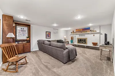 a living room with a couch and a fireplace at Modern Downtown Oasis Sunny Garden King Beds in Longmont