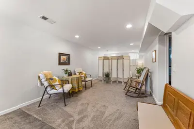 a waiting room with chairs and a table at Modern Downtown Oasis Sunny Garden King Beds in Longmont