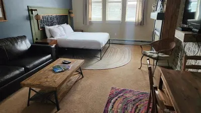 a living room with a bed and a couch at Fraser Crossing Top floor 3603 in Winter Park