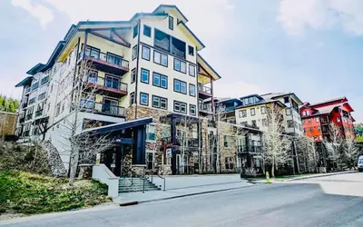 a large building on the side of a street at Fraser Crossing Top floor 3603 in Winter Park