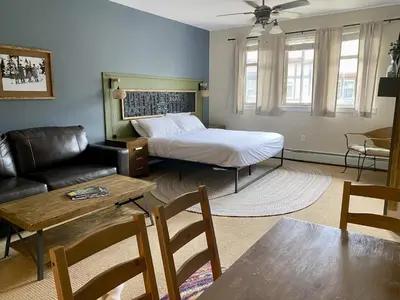 a living room with a bed and a couch at Fraser Crossing Top floor 3603 in Winter Park
