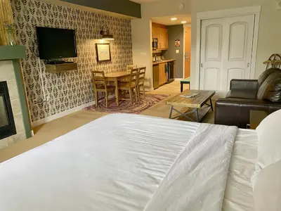 a bedroom with a bed and a living room at Fraser Crossing Top floor 3603 in Winter Park