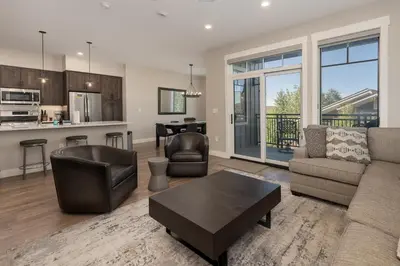 a living room with a couch and a table at Downtown Flat condo in Winter Park