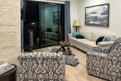a living room with a couch and a chair at Modern Mountain Nest in Silverthorne