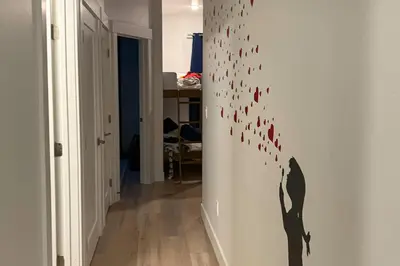 a hallway with a wall with bird decals on it at Modern Mountain Nest in Silverthorne