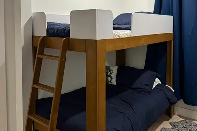 a bunk bed with a ladder in a room at Modern Mountain Nest in Silverthorne