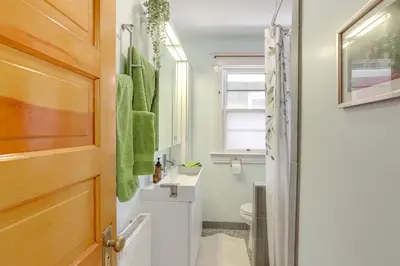 a bathroom with a sink and a toilet at Walk to Denver Zoo City Park Getaway with Garden in Denver
