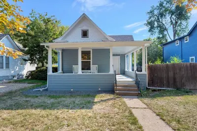 a small house with a blue house at Longmont 2BD Comfort | Outdoor dining + Parking in Longmont