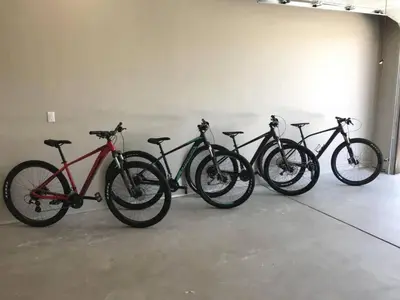 a row of bikes parked in a garage at Winter Park Getaway 4 BR Townhouse w Hot Tub in Fraser