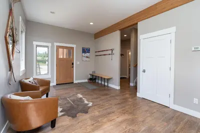 a living room with a couch and a chair at 4BR Fraser Getaway Hot Tub Sleeps 10 in Fraser