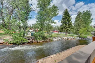 an image of a river with a bridge at Private Hot Tub - Riverfront Cabin In Estes Park! in Estes Park