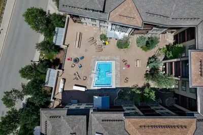 an aerial view of a yard with a swimming pool at Fraser Crossing cabin in Winter Park