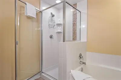 a bathroom with a shower with a glass door at Fraser Crossing cabin in Winter Park