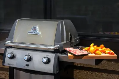 a grill with a bunch of fruit on a cutting board at Aspen View Chalet home in Fraser