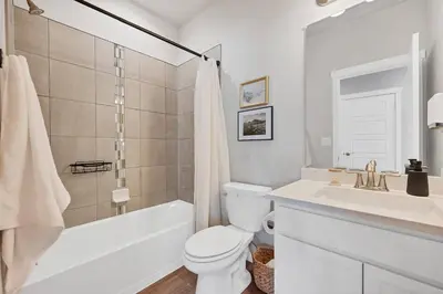 a white bathroom with a sink and a toilet at Luxe 6BD Gem in Johnstown -Tons of Games + Firepit in Johnstown