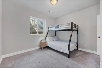 a bedroom with a bunk bed and a window at Luxe 6BD Gem in Johnstown -Tons of Games + Firepit in Johnstown