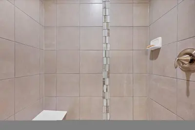 a bathroom with a shower with a toilet at Luxe 6BD Gem in Johnstown -Tons of Games + Firepit in Johnstown