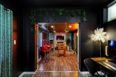 an open door to an office with a dining room at The Denver Duo Two Homes, One Epic Stay in Denver