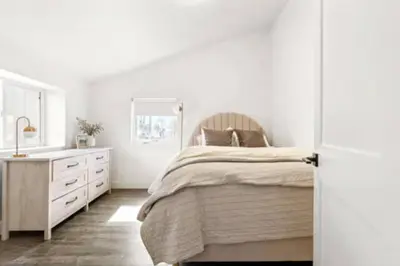 a white bedroom with a bed and a sink at West Denver Radiance Light and Bright 3BR retreat in Denver
