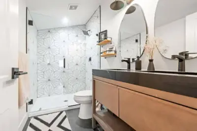 a bathroom with a sink and a toilet and a mirror at West Denver Radiance Light and Bright 3BR retreat in Denver