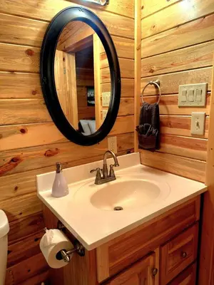 a bathroom with a sink and a mirror at The Red Bears Den, Walk to River & Lake, In Town in Grand Lake
