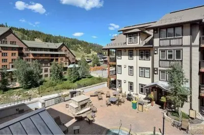 an aerial view of a large building with a patio at Winter Park Village Homebase in Winter Park