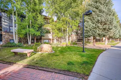 a park with a bench and a rock and a street light at Frostfire B19 condo in Snake River Health Services Incorporated Heliport