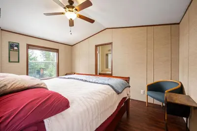 a bedroom with a bed and a ceiling fan at Zig Zag Retreat, Cozy, Pet-Friendly Escape Near Lakes, and Rocky Mountain National Park in Grand Lake