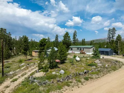 a farm with bikes parked on a dirt road at Zig Zag Retreat, Cozy, Pet-Friendly Escape Near Lakes, and Rocky Mountain National Park in Grand Lake