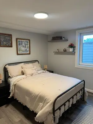 a bedroom with a bed and a window at Relax & Recharge, Peaceful Home in Northglenn