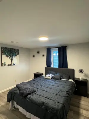 a bedroom with a large bed and a window at Relax & Recharge, Peaceful Home in Northglenn