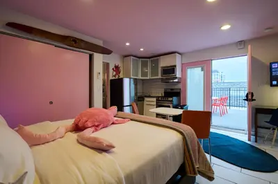 a bedroom with a stuffed animal laying on a bed at BIG little Hotel in Denver