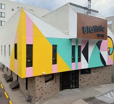 a building with a colorful mural on the side at BIG little Hotel in Denver