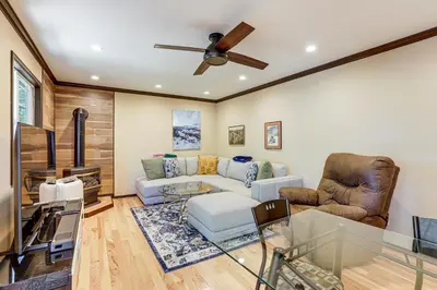 a living room with a couch and a ceiling fan at Pet-Friendly Retreat with Fenced Yard in Aurora in Aurora