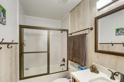 a bathroom with a shower and a toilet and a sink at Pet-Friendly Retreat with Fenced Yard in Aurora in Aurora