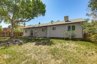 an empty yard in front of a house at Pet-Friendly Retreat with Fenced Yard in Aurora in Aurora