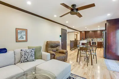 a living room with a couch and a ceiling fan at Pet-Friendly Retreat with Fenced Yard in Aurora in Aurora