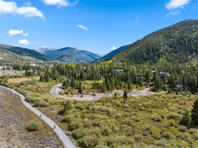 an aerial view of a river in a valley with mountains at Luxury Stay Meets Family Fun- Premier 1BR Retreat condo in Keystone