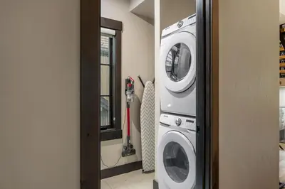 a washing machine and a dryer in a room at Blue Horizon Chalet home in Winter Park