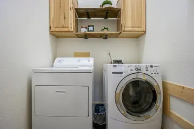 a washing machine and a washer in a small room at Estes Park Luxury Family Retreat in Estes Park